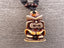 Collier avec pendentif Tiki marron - bijou Maori