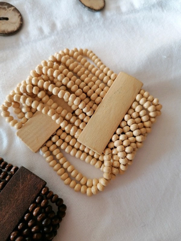 Bracelet beige en bois d'acacia monté sur élastique artisanat Bali