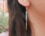 Boucles d'oreilles pendantes en Howlite Turquoise et plume