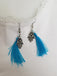 Boucles d'oreilles pompons bleu turquoises et main de Fatma